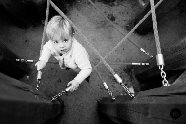 boy-climbs-in-holland-park-playground