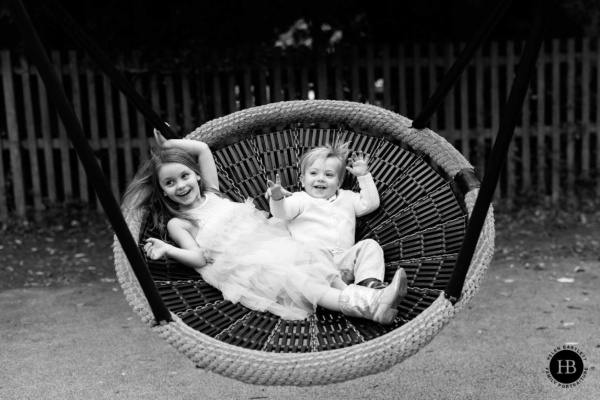 children-enjoy-the-swings-on-playground-in-holland-park