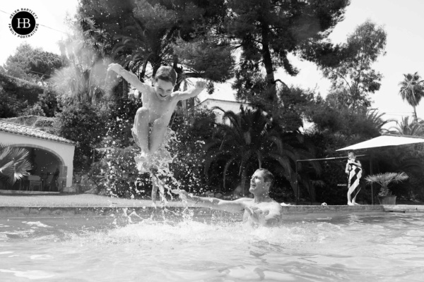 dad-throws-boy-in-air-swimming-pool