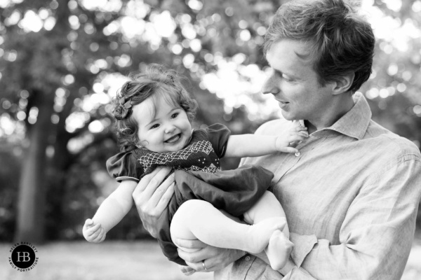 father-plays-with-happy-baby-daughter