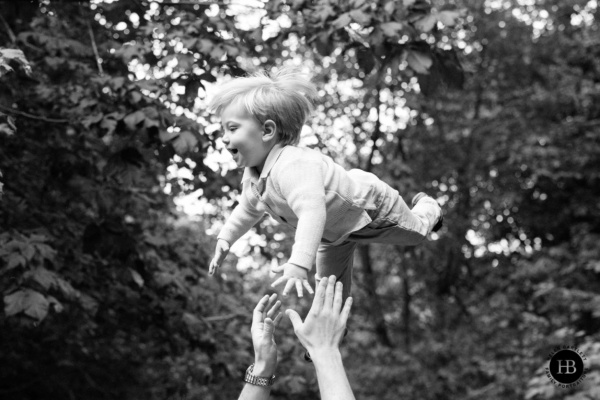 father-throws-son-in-joyful-portrait