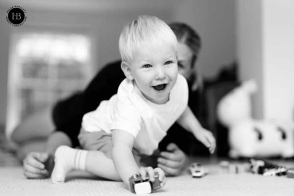 joyful-little-boy-plays-cars