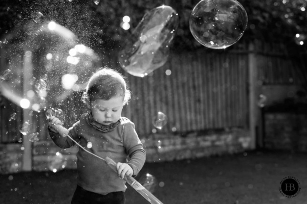 little-girl-plays-with-bubble-wand