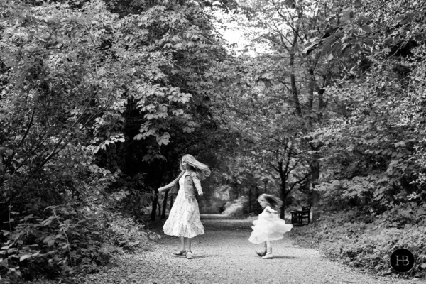 mother-and-daughter-spin-on-sunlit-path