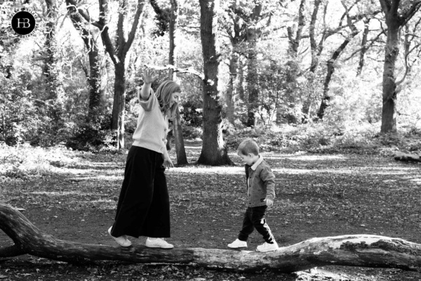 mother-and-son-balance-on-log