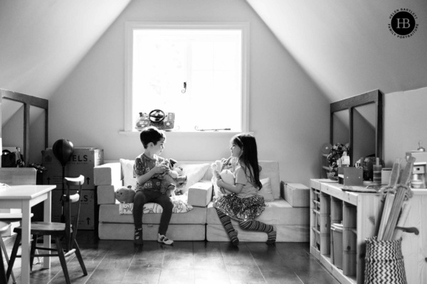 children-play-by-window-at-home-family-photography-session