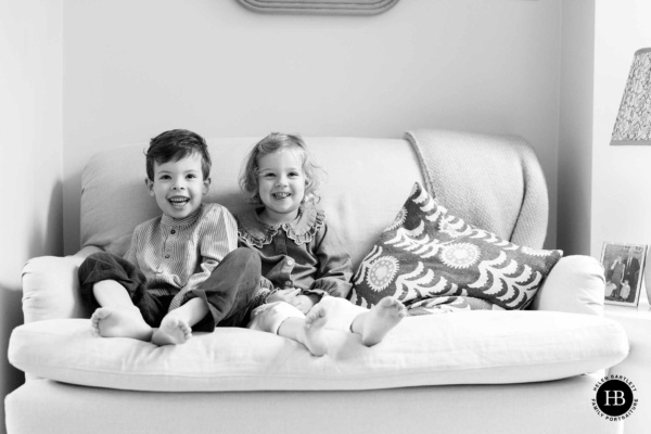 laughing-portrait-young-children-on-sofa