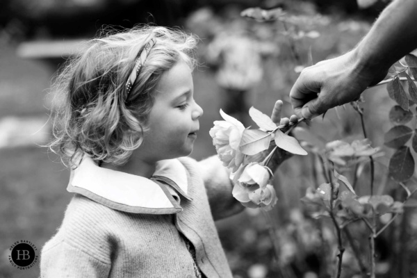 little-girl-smells-roses