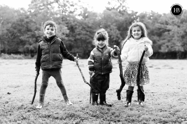 three-children-laughing-on-family-photo-shoot