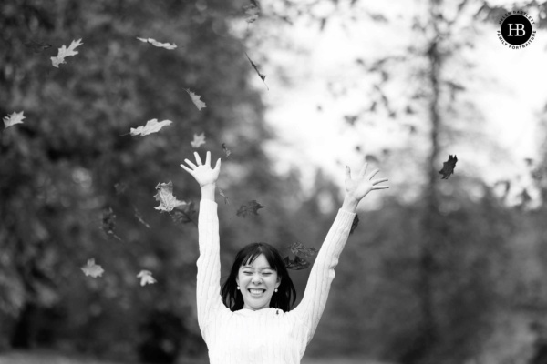 gen-z-happy-throwing-leaves-in-air-laughing