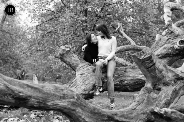 mother-and-daughter-sit-on-tree-happy-together