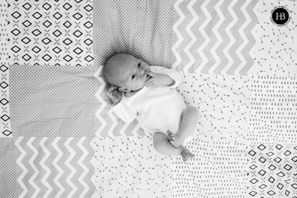 newborn-baby-on-patterened-quilt