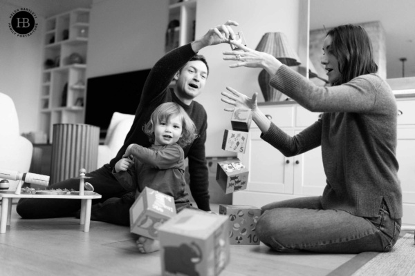 child-knocks-over-tower-of-blocks-at-home-photo-shoot-highgate