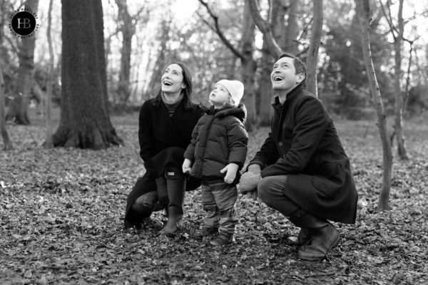 family-look-for-woodpecker-during-photo-shoot-in-north-london-wood