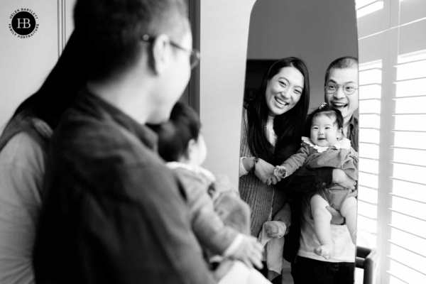 family-look-at-baby-in-mirror