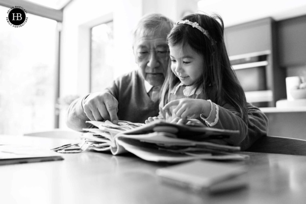 grandfather-reads-book-with-grandaughter