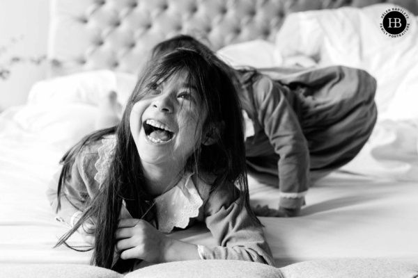 laughing-children-on-bed