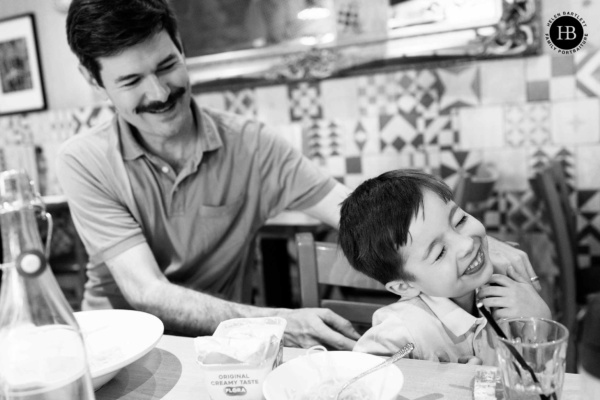 father-son-laughing-in-favourite-restaurant