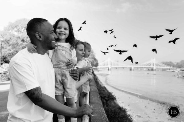flock-birds-fly-by-family-looking-at-river-battersea