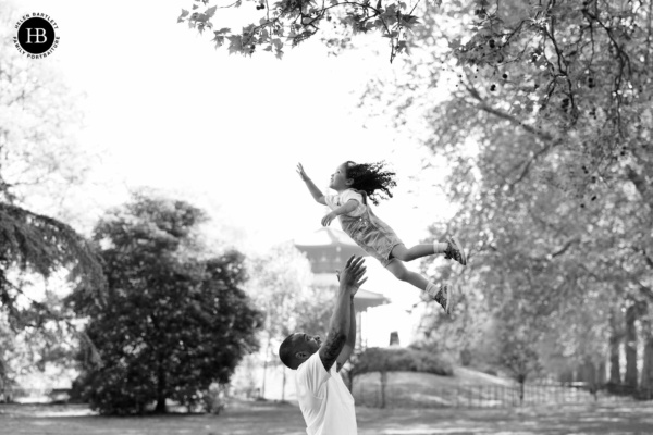 girl-thrown-in-air-battersea-peace-pagoda-in-background