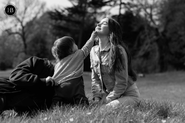 little-boy-holds-buttercup-to-sisters-face