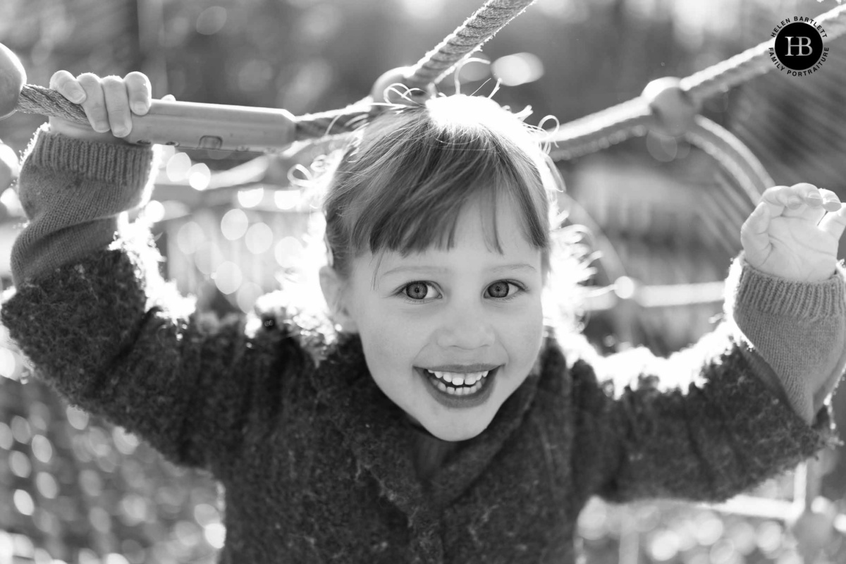 portrait-girl-on-net-in-playground-highgate-wood-north-london