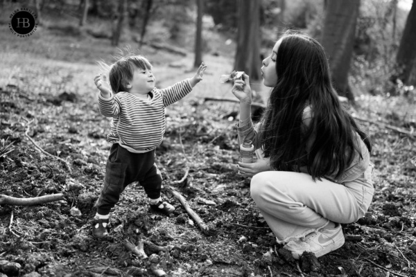 sister-blows-bubbles-for-baby-brother