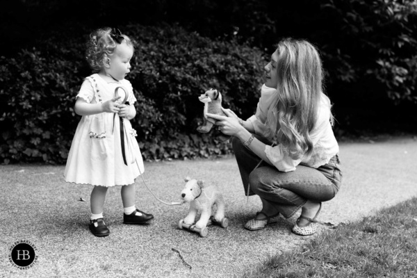 little-girl-and-mum-play-with-toy-animals