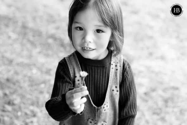 little-girl-holds-daisy