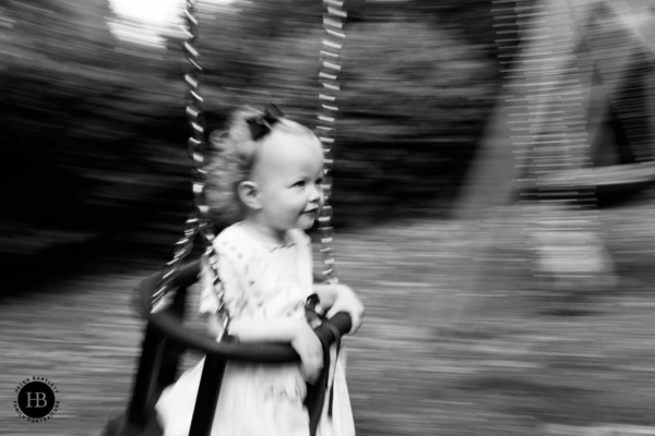 panning-shot-happy-girl-on-swing