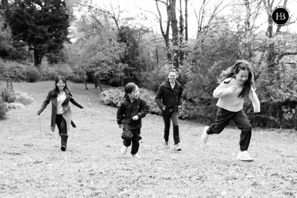 Mill Hill Family Photography with everyone running through the garden