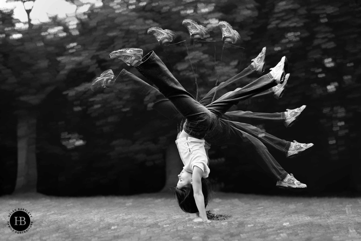 Multiple exposure image of a girl performing a gymnastics cartwheel, creative black and white family photography