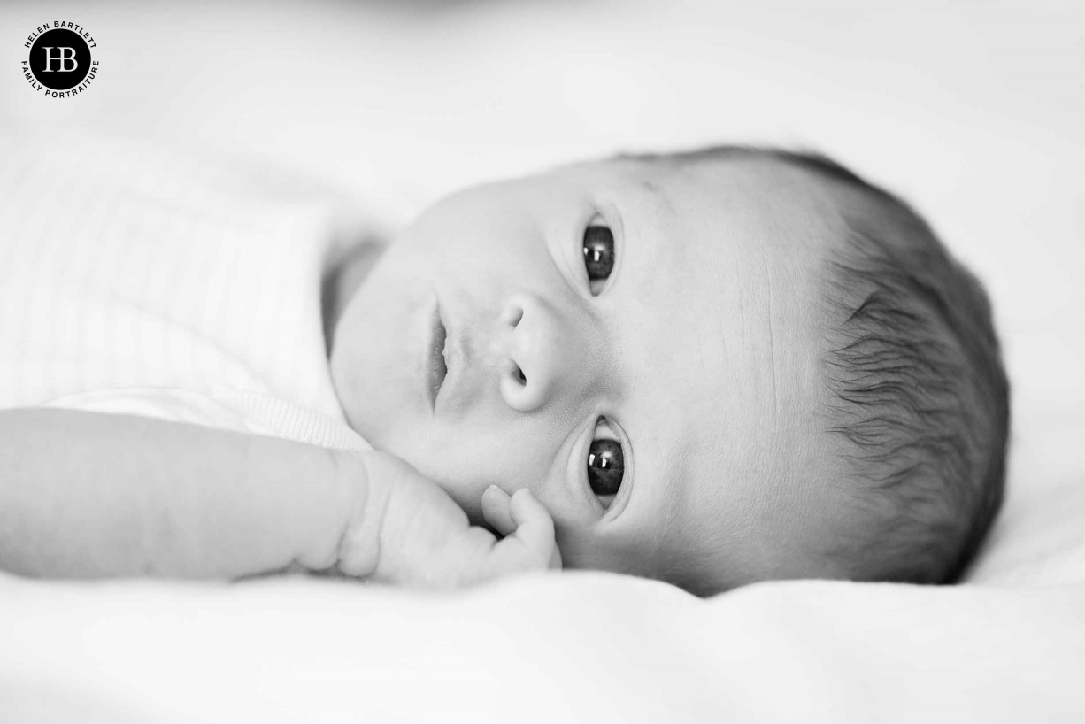 newborn baby photography little girl looks at camera in south london