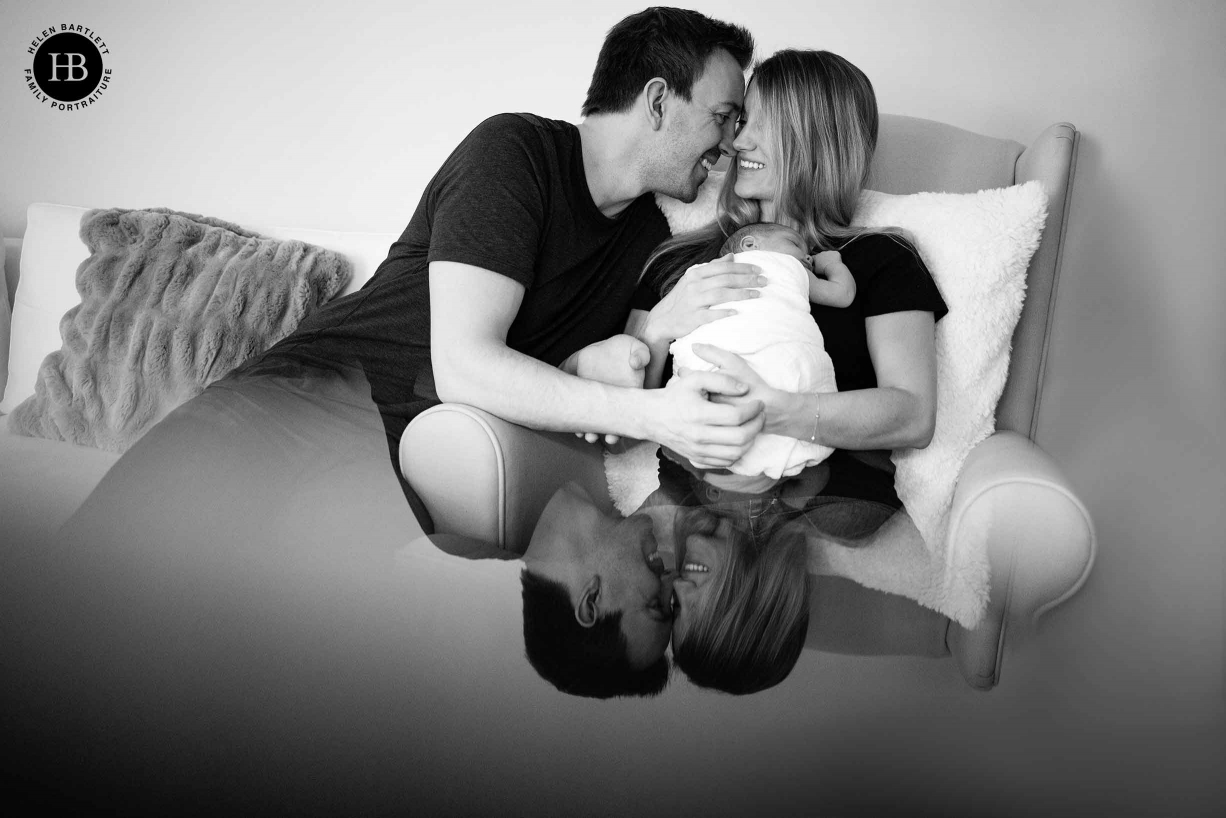 professional newborn family photo with prism reflection