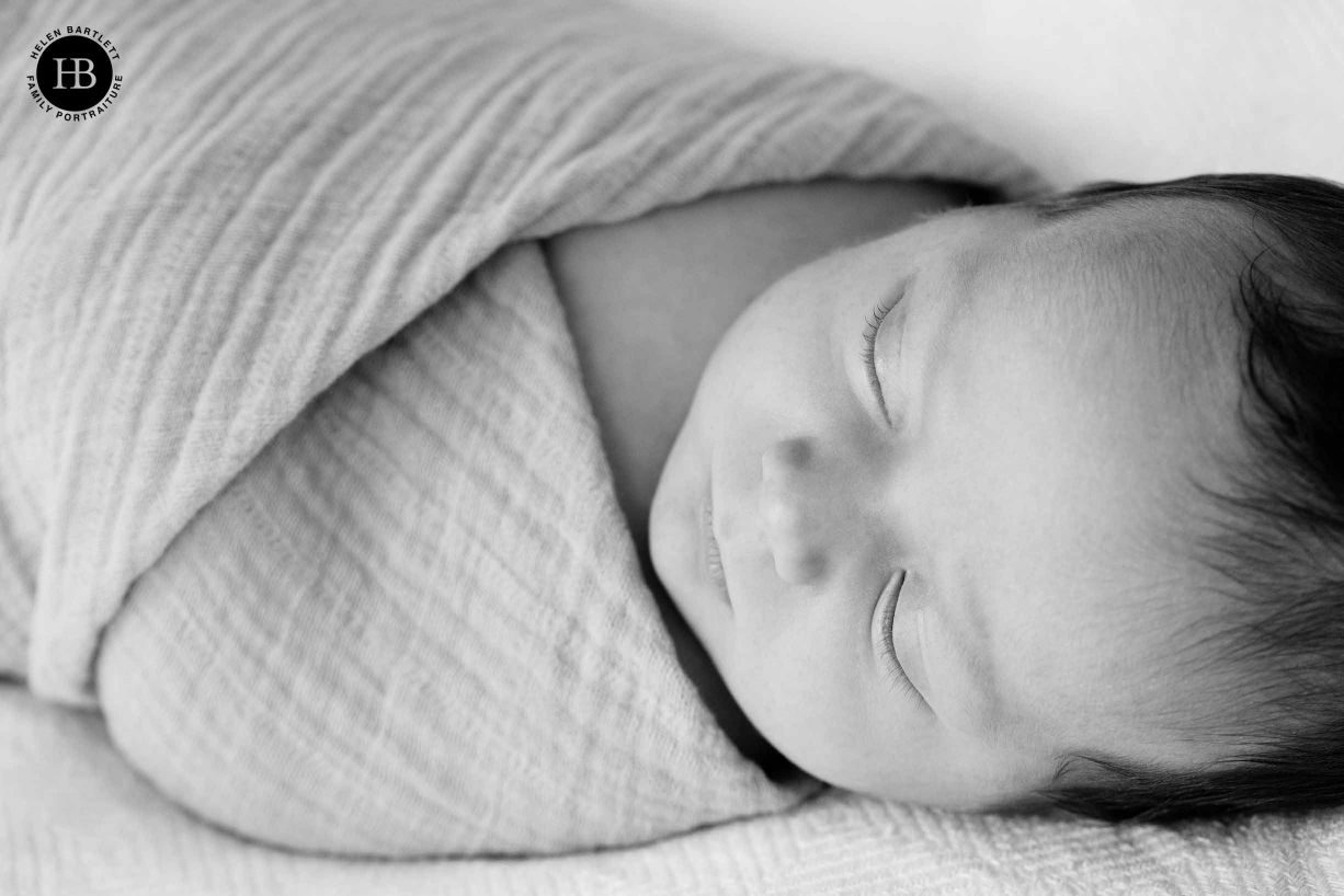 swaddled newborn baby sleeps soundly