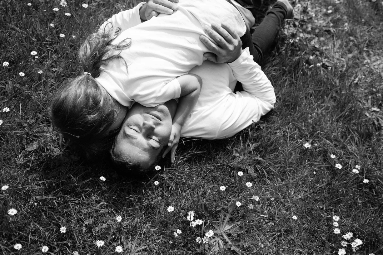 Lying on a daisy-strewn meadow, you can dream all day, like this girl in a family portrait from Helen Bartlett, taken in Kew Gardens.