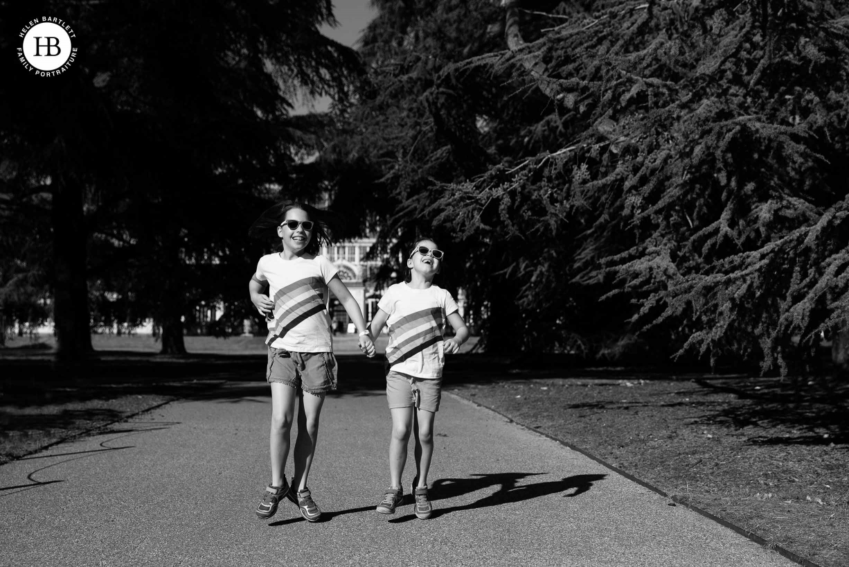 matching outfits can look brilliant in photos as we see with two girls in matching rainbow t-shirts