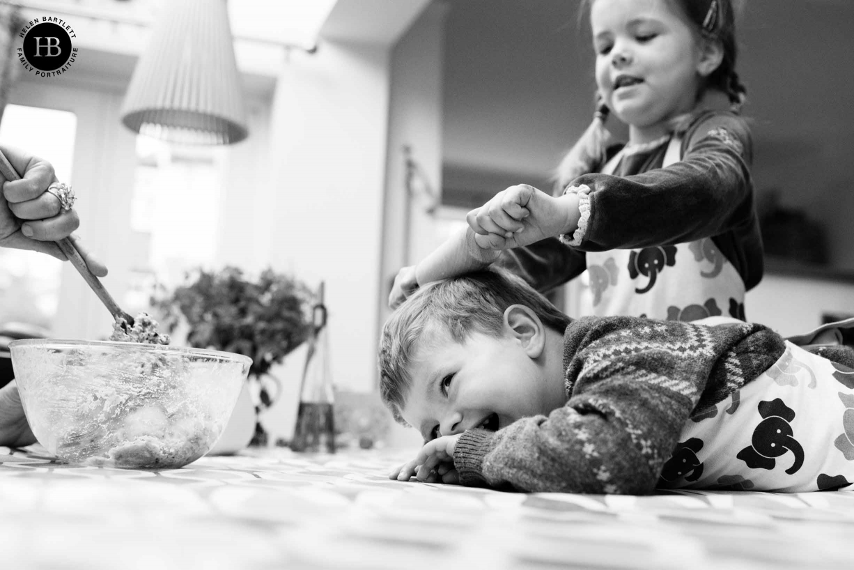 Two young children bake biscuits and play. Indoor photo shoots are fantastic to capture memories of things children do at home every day