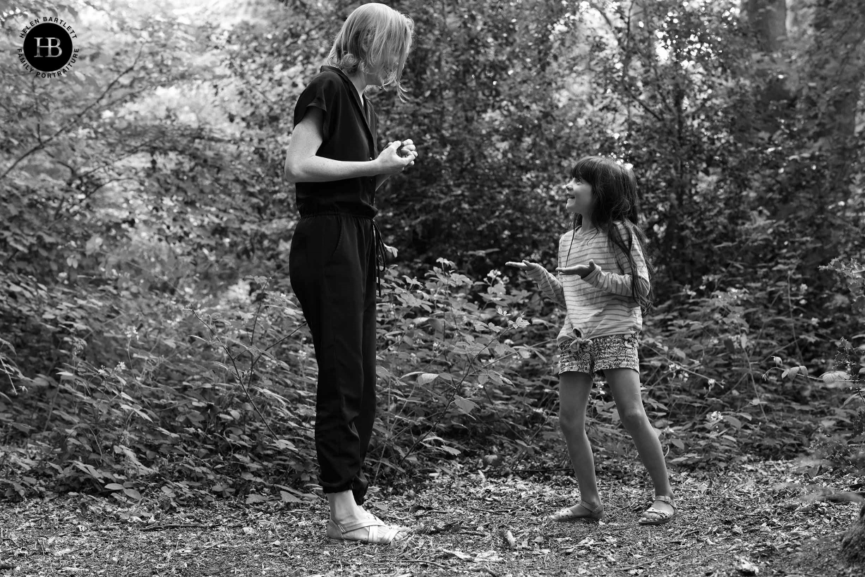 Little girl looks up questioningly at her mother. Image shot at 1/30 and pin sharp to demonstrate in body image stabilisation of Canon EOS R5