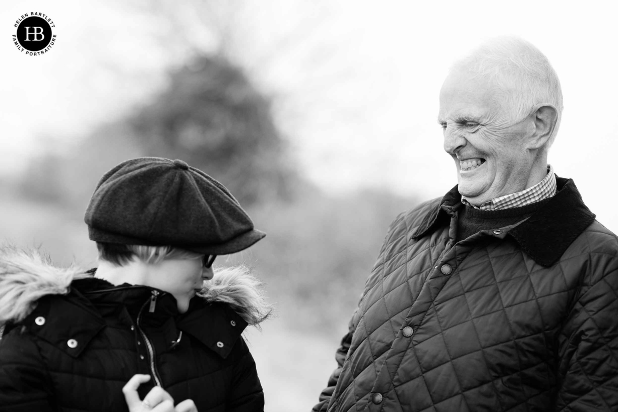 grandfather-laughs-with-teenage-granddaughter