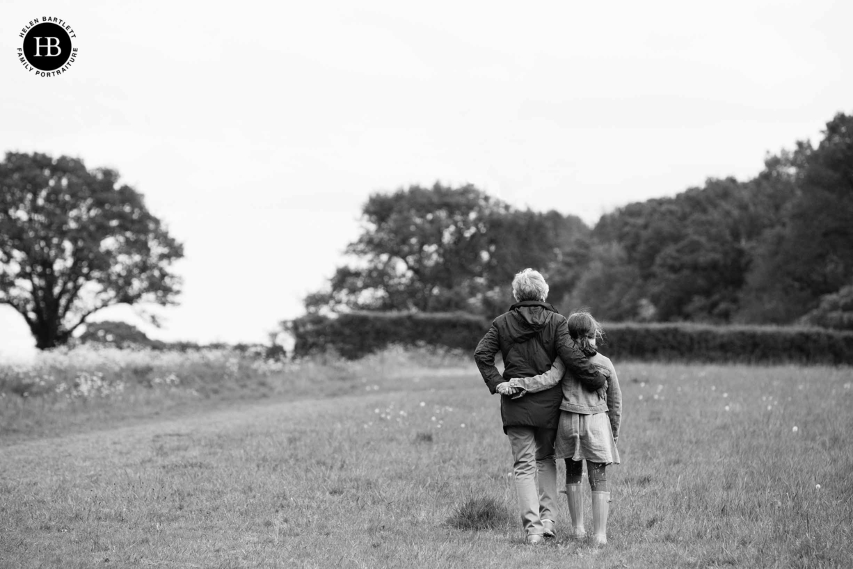 grandmother-and-granddaughter-walk-with-arms-around-each-other