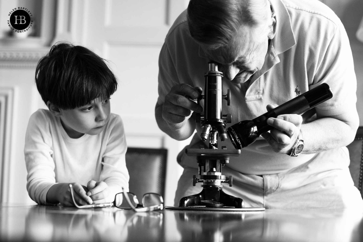 little-boy-taught-science-by-grandfather-on-family-photo-shoot-with-grandparents