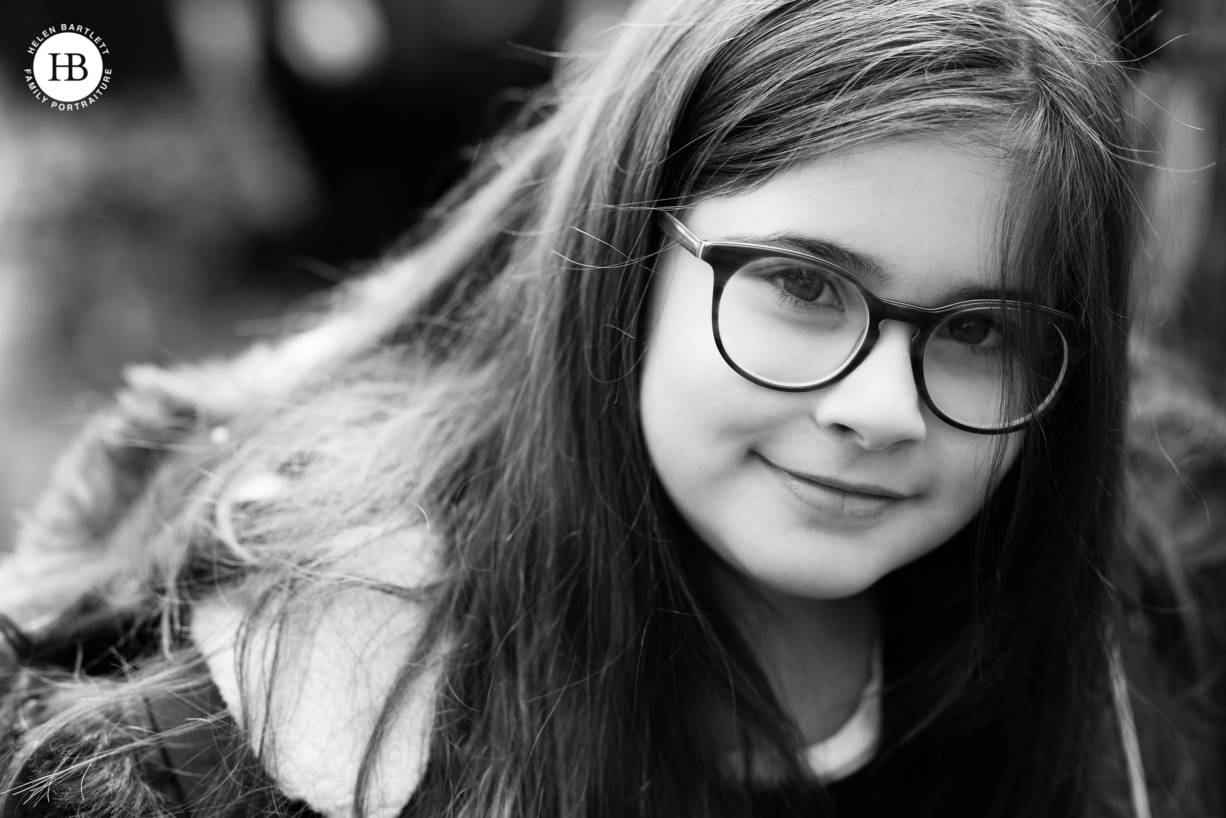 portrait of little girl wearing glasses