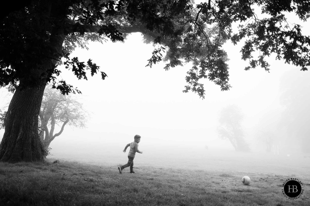 boy-plays-football-in-fog-balham-family-photography