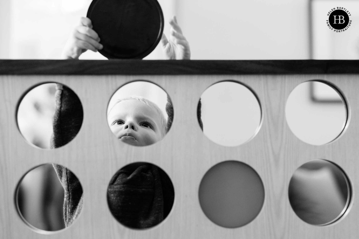 little-boy-plays-giant-connect-four-family-photoshoot