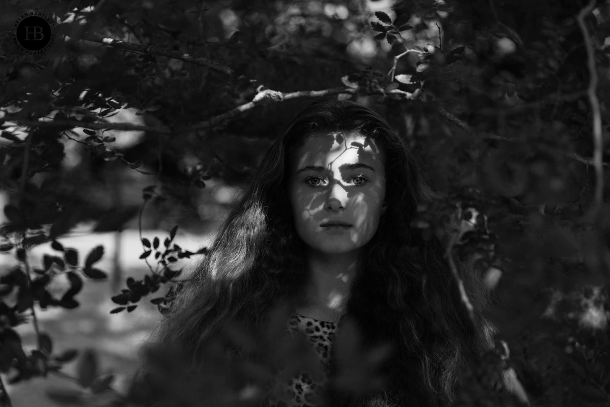 portrait of teenage girl with shadows of tree on her face, very beautiful