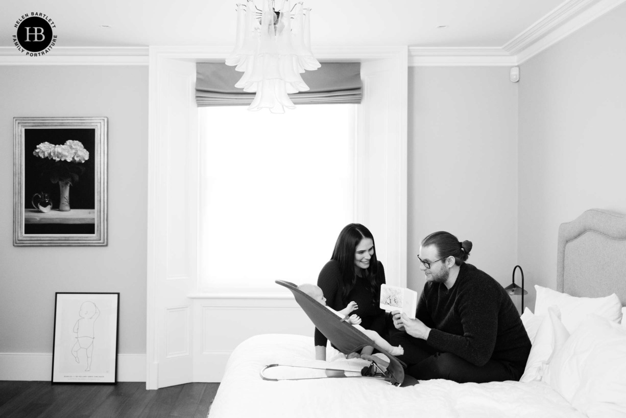 parents-read-to-baby-during-family-photo-shoot-primrose-hill