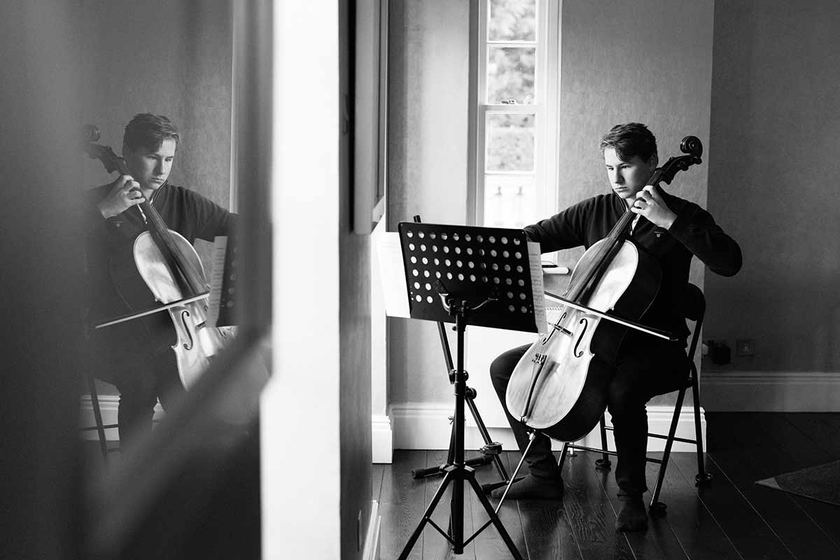 teenager-plays-cello-on-family-photography-session-sevenoaks