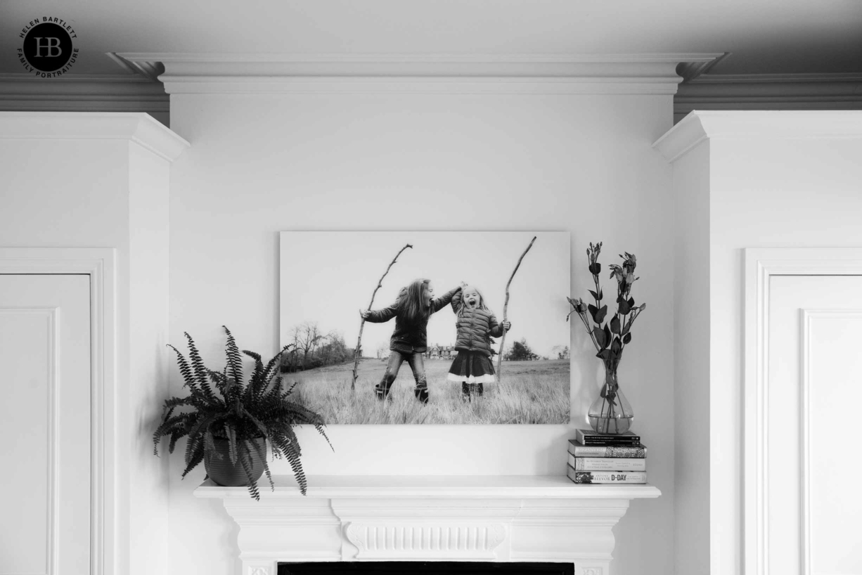 large acrylic print hung above fireplace