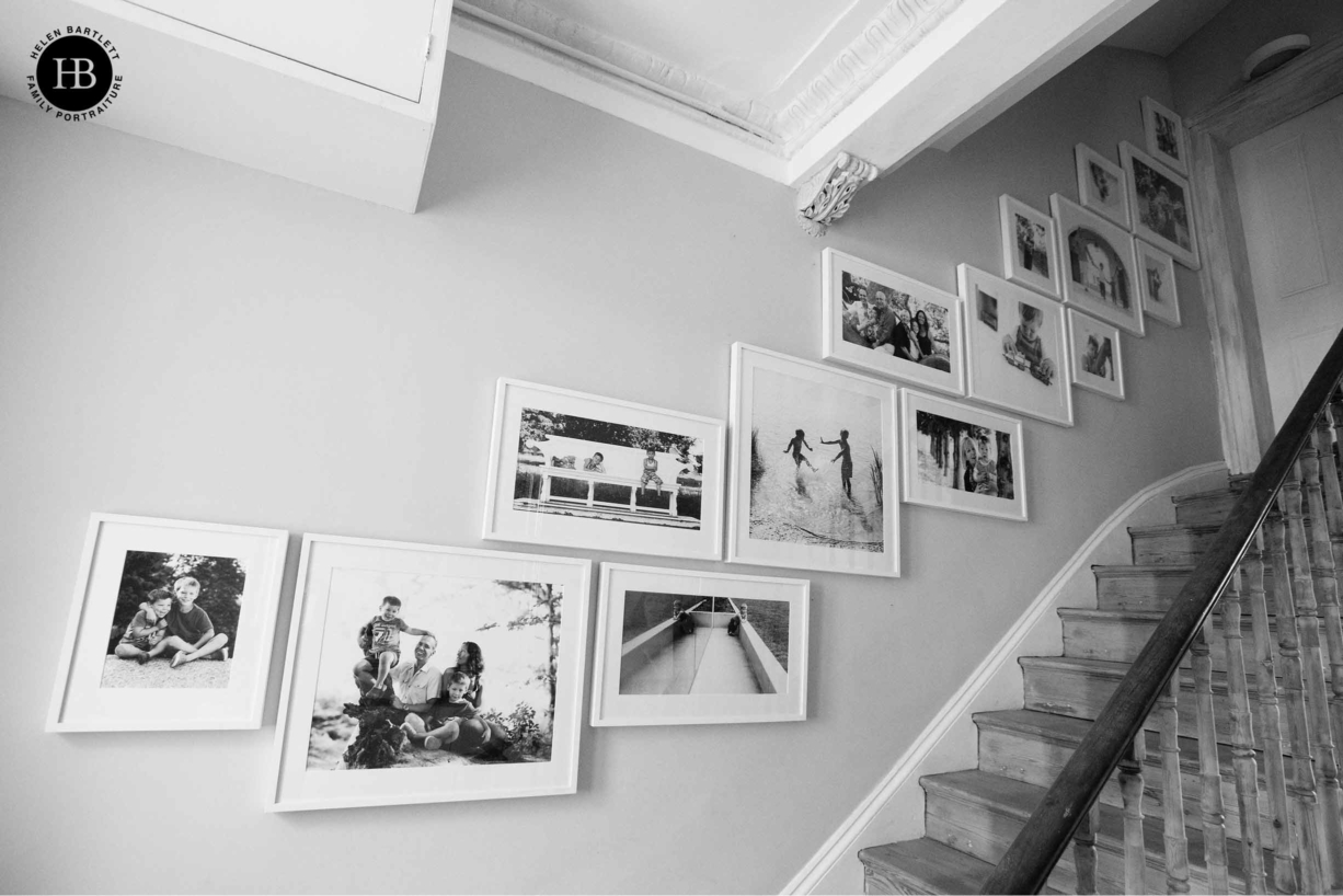 stairway gallery of framed fine art family photographs